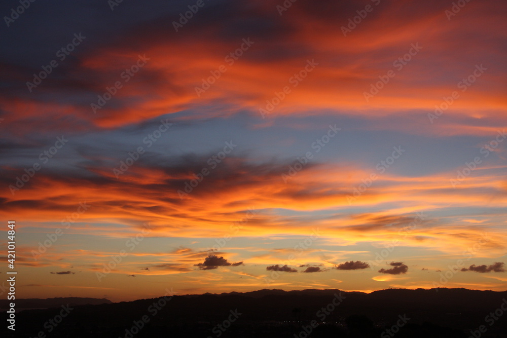 Pink and orange clouds in the evening sky, natural background