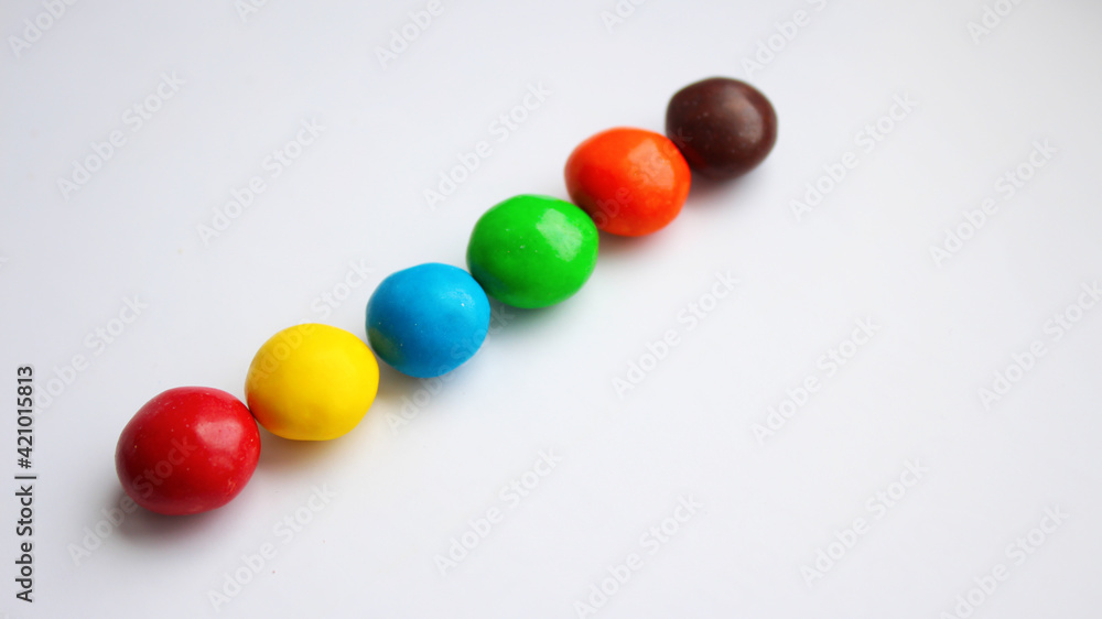 Colorful chocolate candy treat on white isolated background. ММ Colorful chocolate candy treat on white isolated background. ММ