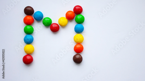 Colorful chocolate candy treat on white isolated background. ММ