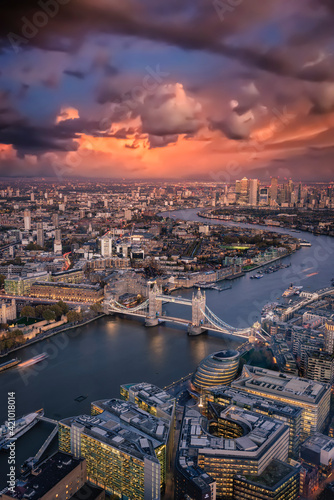 Elevated view of the London skyline: from the Tower Bridge to the financial district Canary Wharf just after sunset, United Kingdom