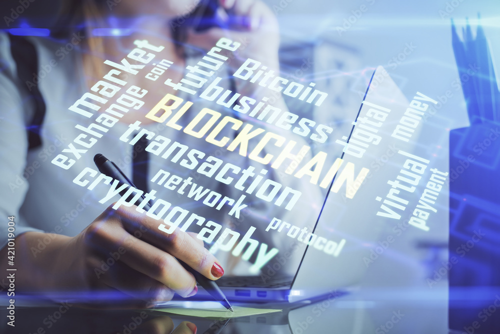Double exposure of woman hands typing on computer and crypto market theme hologram drawing. Blockchain concept. Double exposure of woman hands typing on computer and crypto market theme hologram drawing. Blockchain concept.