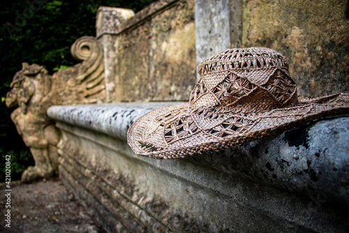 Straw Hat on Stone Bench