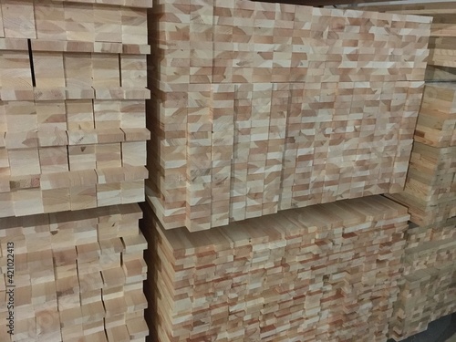 Warehouse for wooden materials. Particleboard and fiberboard close-up. Preparation of elements for creating products