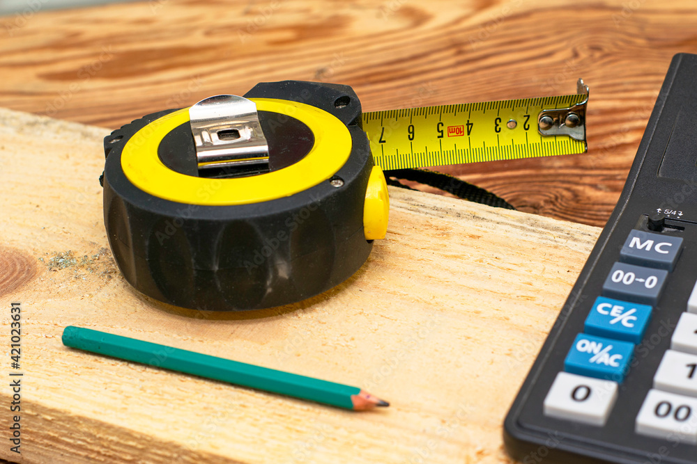 construction metertape measure calculator for calculations pencil and