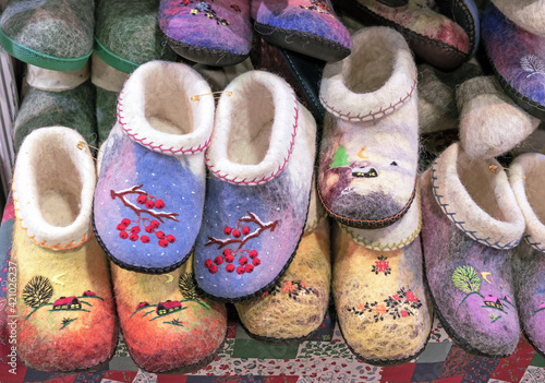 Felt slippers or home felt boots with bright embroidery in the Russian style.