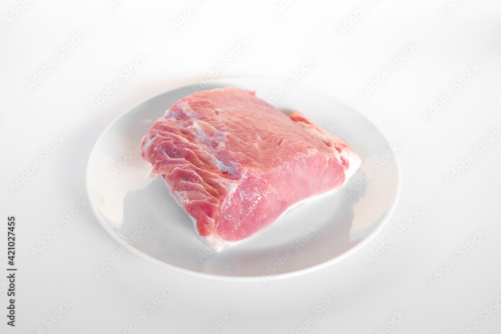 sliced raw pork meat isolated on white background ready for cooking. a piece of pork sliced raw pork meat isolated on white background ready for cooking. a piece of pork