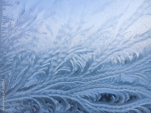 Beautiful frosty patterns on the window. Natural textures.