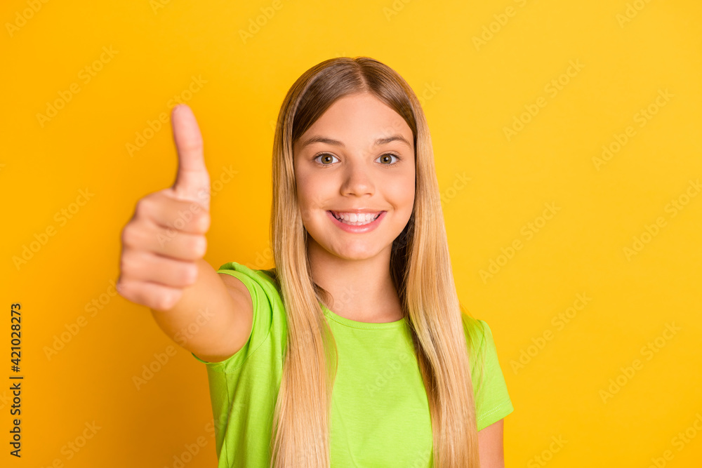 Photo of young girl happy positive smile show thumb-up like cool perfect ad feedback isolated over yellow color background Photo of young girl happy positive smile show thumb-up like cool perfect ad feedback isolated over yellow color background