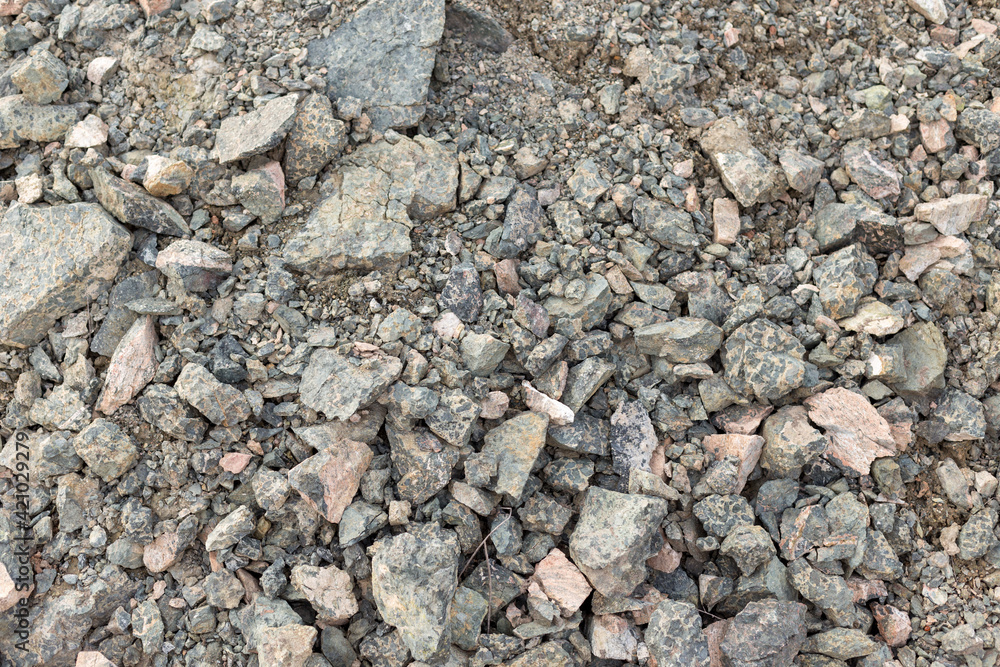 Crushed mountain stones on the ground texture background in the image Crushed mountain stones on the ground texture background in the image