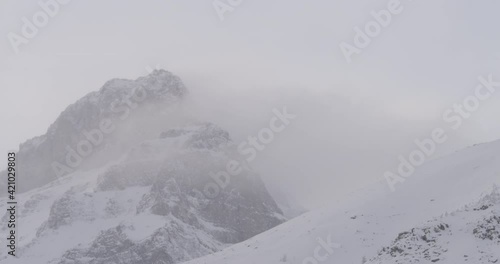 Wallpaper Mural Snowy mountain tops at winter with clouds moving by quickly Torontodigital.ca
