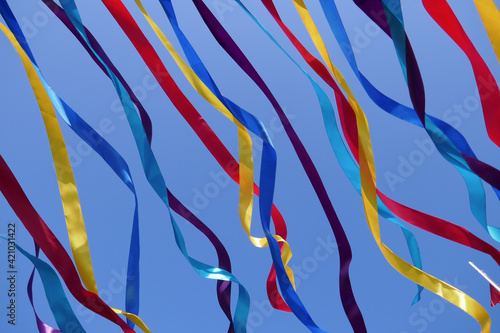 Bright multi-colored ribbons against the sky.