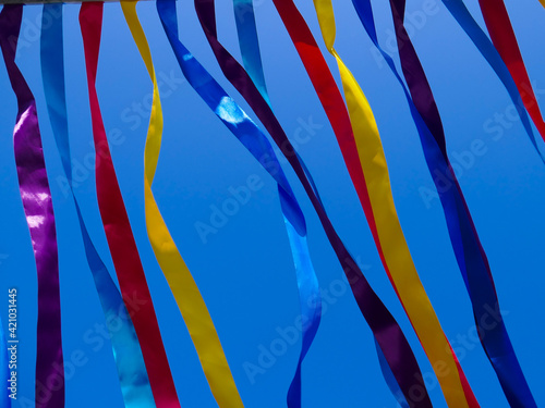Bright multi-colored ribbons against the sky.