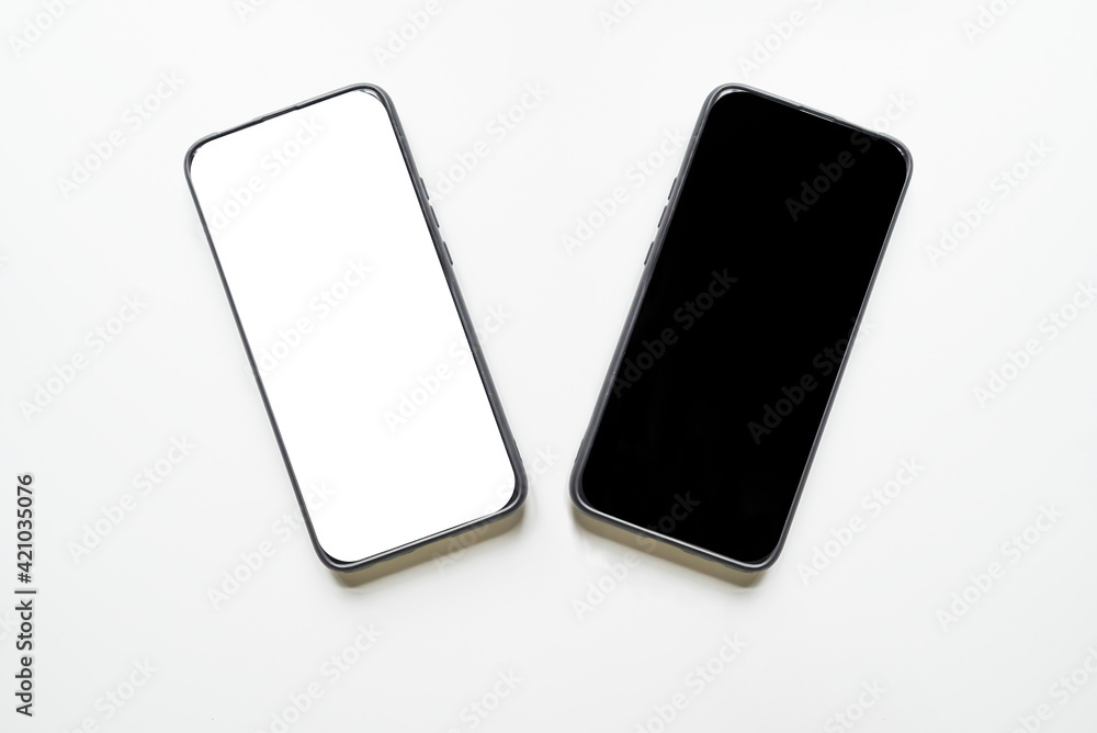 Mobile phone with black and white screen on a white background. There is copy space for the text. Mobile phone with black and white screen on a white background. There is copy space for the text.