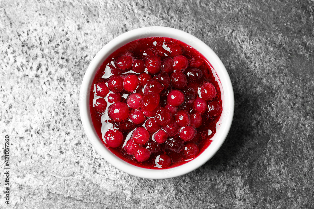 Fresh cranberry sauce on grey table, top view Fresh cranberry sauce on grey table, top view