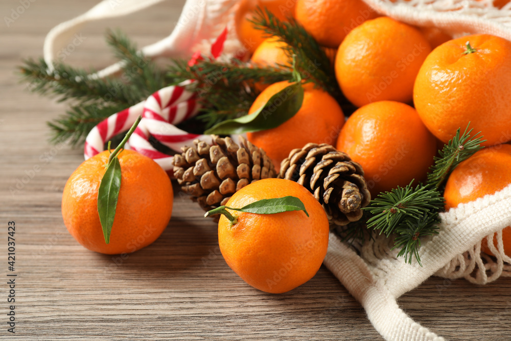 Mesh bag filled with fresh tangerines. Top view. Stock Photo