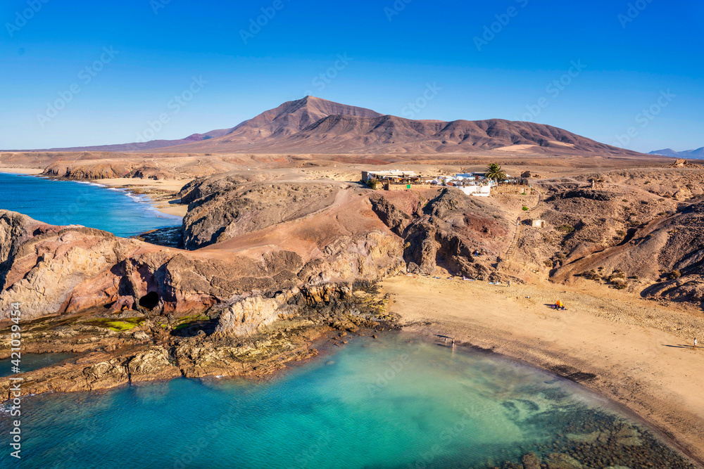 Playa de Papagayo Beach, desert landscape and blue sky. Lanzarote