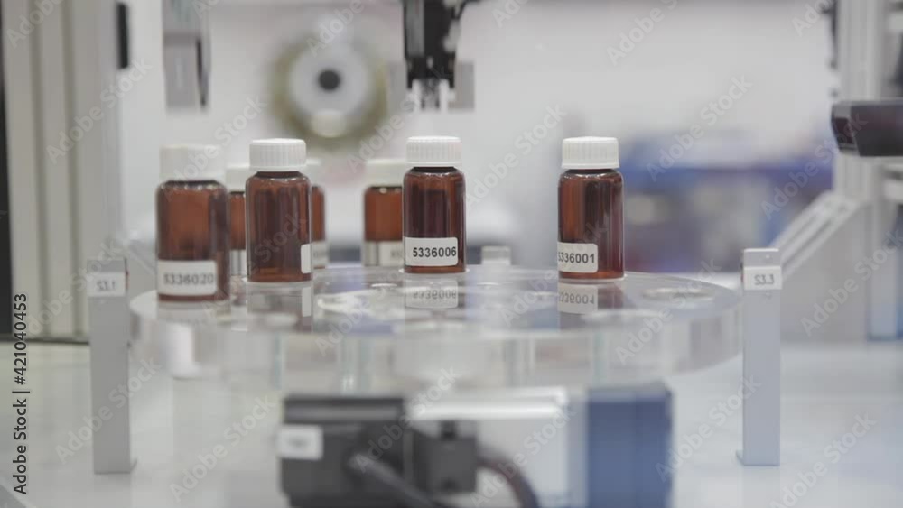 Packing Drugs in Glass Bottles Pharmaceutical Production Packing Drugs in Glass Bottles Pharmaceutical Production