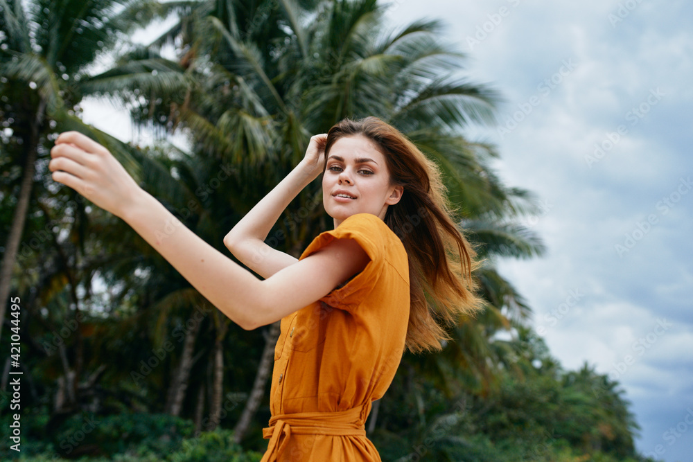 delightful woman in a sundress has a rest on the nature on the island delightful woman in a sundress has a rest on the nature on the island