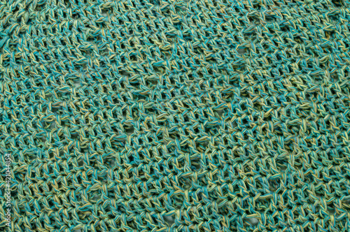 crochet thread blue green and yellow texture background closeup