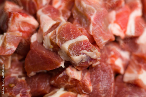Raw pork chops close up. Uncooked pieces of meat background. Red meat. Piece of fresh raw meat background