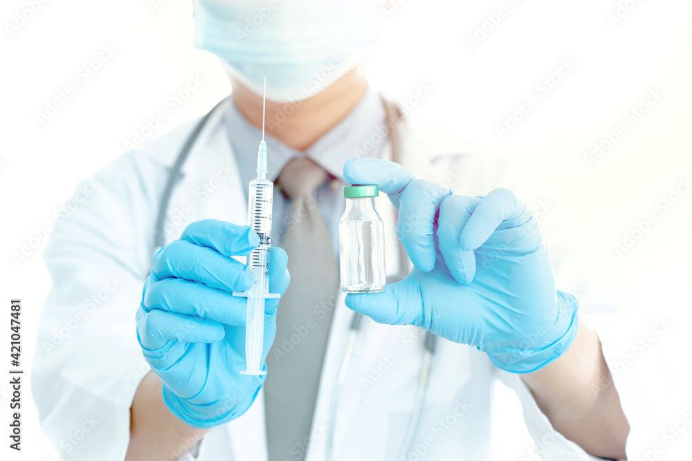 Close up vaccines fight against virus, doctor or scientist in laboratory holding a syringe with liquid vaccines. Concept : diseases, Close up vaccines fight against virus, doctor or scientist in laboratory holding a syringe with liquid vaccines. Concept : diseases,