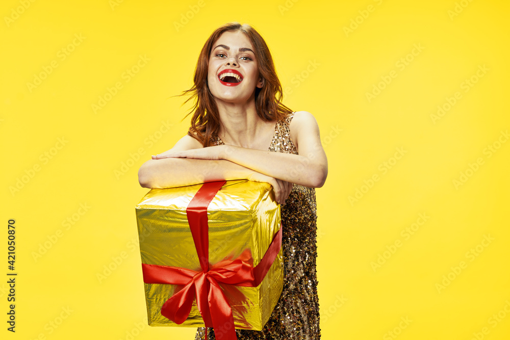 Happy girl celebrates birthday with a gift box Happy girl celebrates birthday with a gift box
