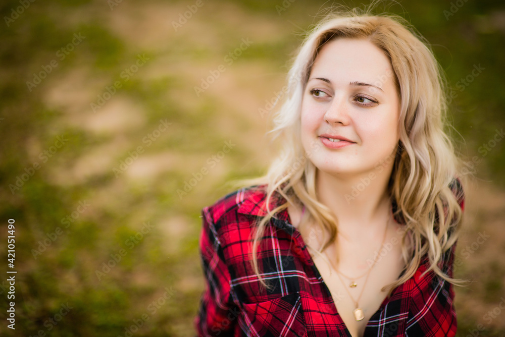 blonde girl in red shirt in nature, selective focus blonde girl in red shirt in nature, selective focus