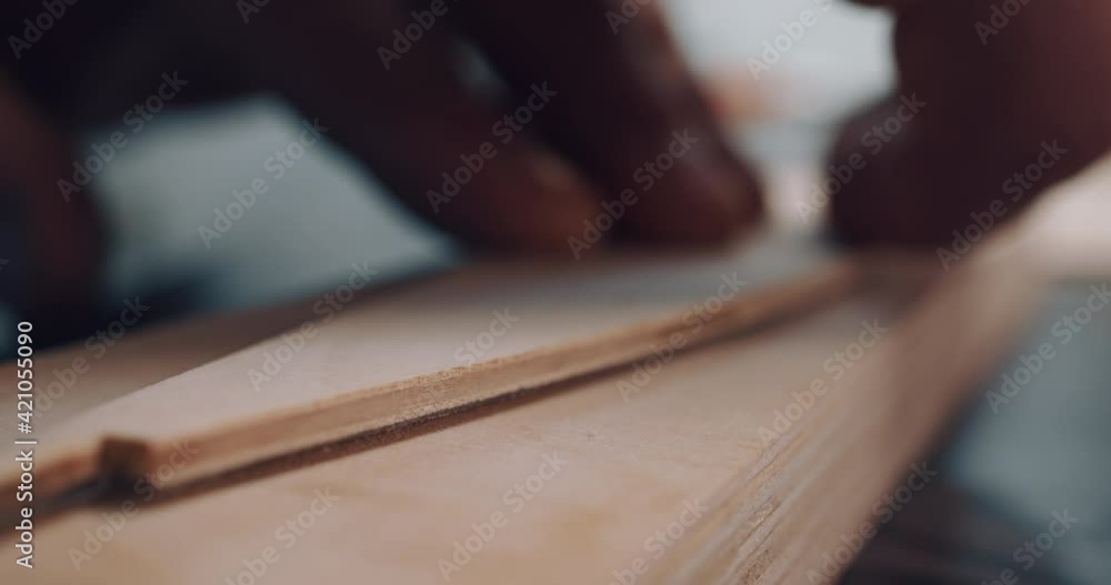 Close-up macro shot male craftsman takes wood detail draws outline with pencil before cutting on work table in woodworking workshop. Process of creating wooden bird toy. Small business, hobby concept Close-up macro shot male craftsman takes wood detail draws outline with pencil before cutting on work table in woodworking workshop. Process of creating wooden bird toy. Small business, hobby concept