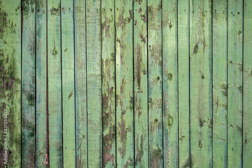 Old wooden fence with green paint background texture. Old wooden fence with green paint background texture.
