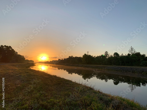 Sunrise over a drainage canal in Weston Florida.