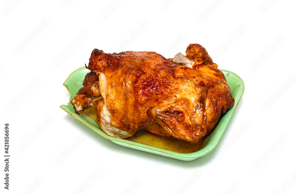 Grilled chicken on a plate on a white background. Grilled chicken on a plate on a white background.