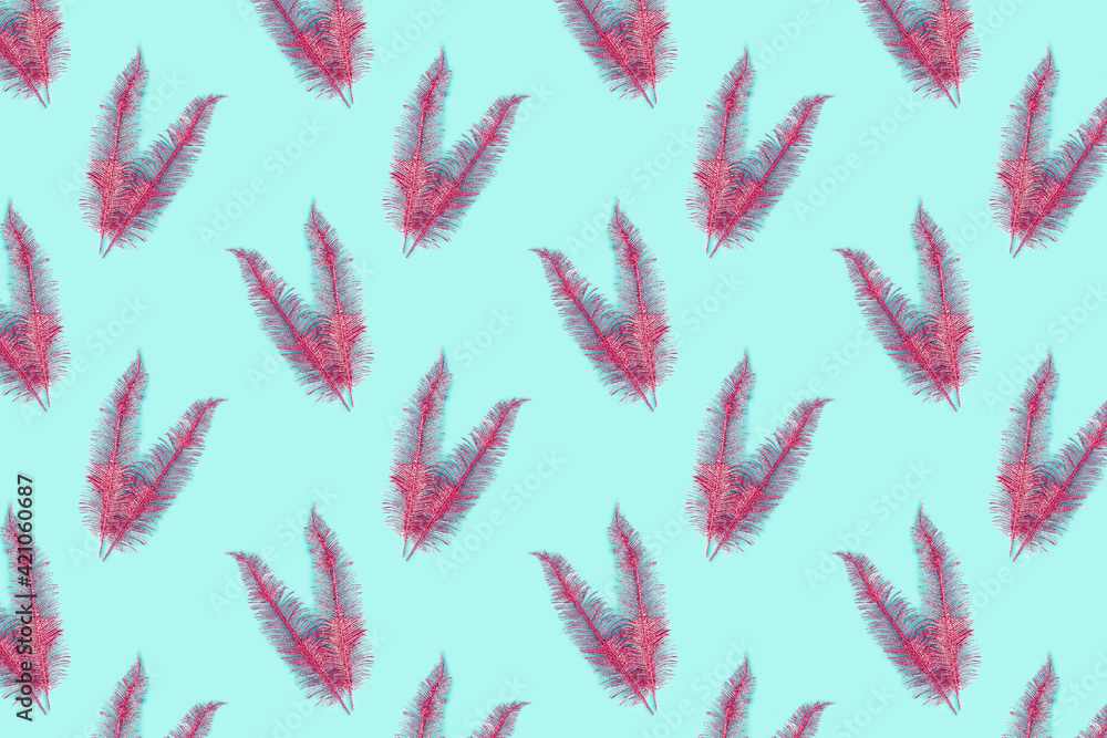 Seamless pattern feathers on a turquoise background. Creative packaging design in the concept of minimalism. Seamless pattern feathers on a turquoise background. Creative packaging design in the concept of minimalism.