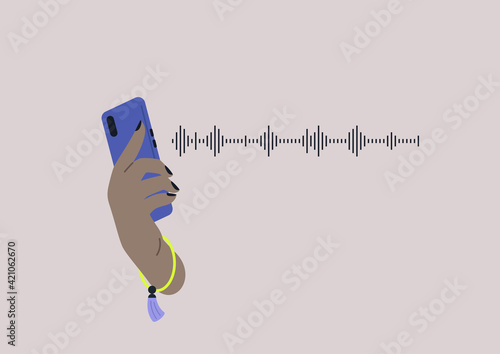 A voice message concept, a sound wave, listening to music, a hand holding a smartphone