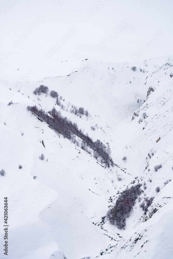 Fototapeta premium Snowy winter mountains in Georgia. Caucasus Mountains