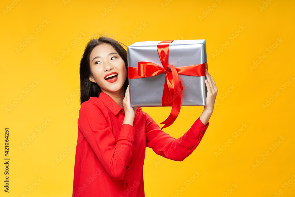 Happy woman with gifts in her hands laughs Happy woman with gifts in her hands laughs