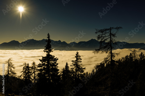 sunrise in the mountains above the clouds