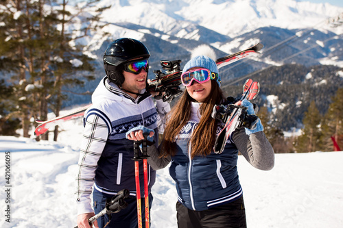 Winter vacation - portrait of skiers in ski resort.
