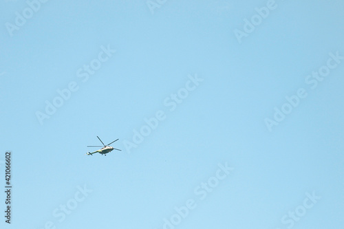 View of a helicopter in the sky. Helicopter ground view.
