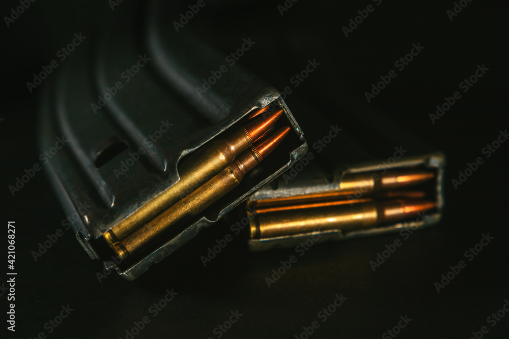 Top view of gun magazines on a black surface background. Rifle. M4. 5,56x45 Top view of gun magazines on a black surface background. Rifle. M4. 5,56x45