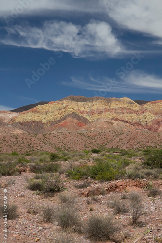 Hiking. View of the colorful rock, mountains and arid desert under a beautiful sky.