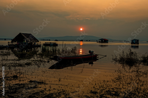 sunset with fisher boat,thailand photo