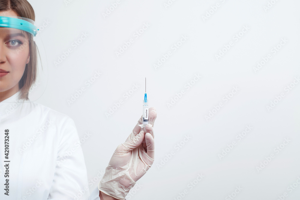 Doctor holding syringe with vaccine, closeup. Vaccination and immunization concept. Virus protection. Doctor holding syringe with vaccine, closeup. Vaccination and immunization concept. Virus protection.