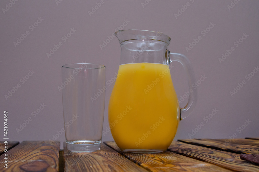 Fresh orange juice in a clear glass jug Fresh orange juice in a clear glass jug