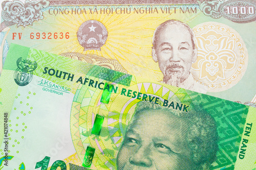 Wallpaper Mural A macro image of a shiny, green 10 rand bill from South Africa paired up with a colorful, plastic ten thousand dong note from Vietnam.  Shot close up in macro. Torontodigital.ca