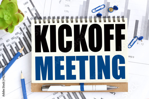 Kick-off meeting . Concept Image. Text on white notepad paper on light background. Business and financial conzept photo