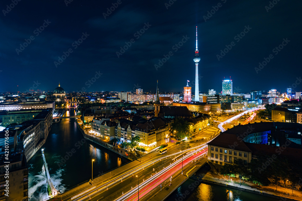 Fototapeta premium Berlin, Germany, panoramic view of Berlin cityscape and Spree River at night.