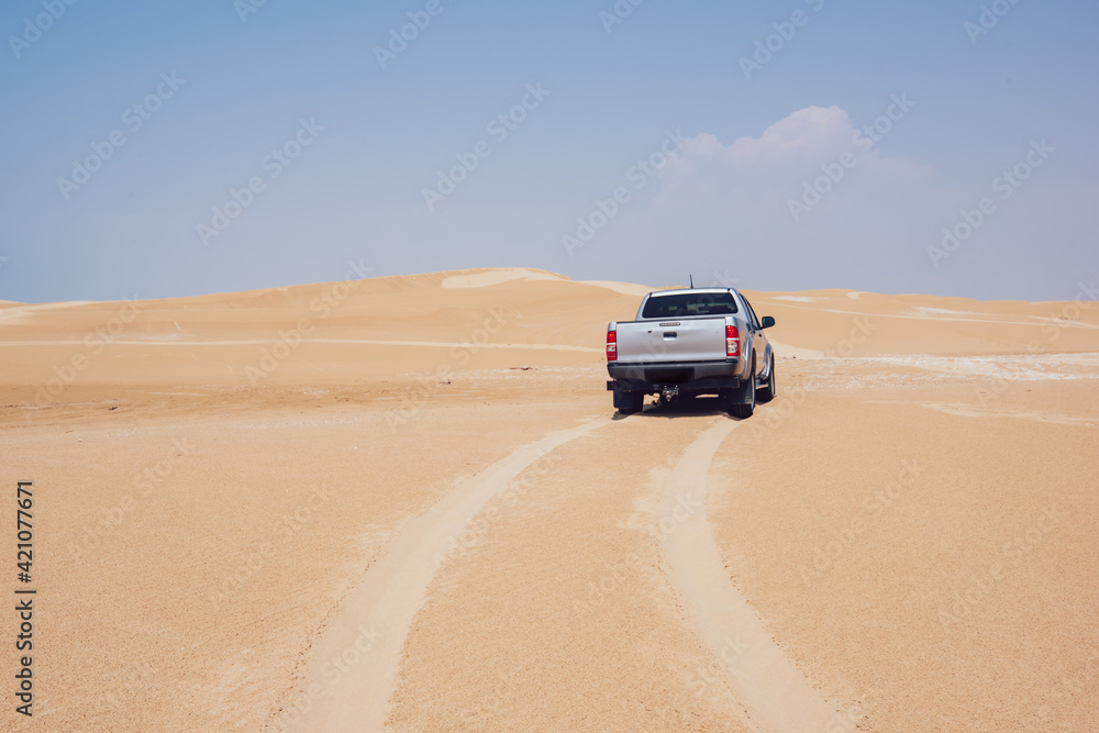 Pickup on sandy dunes in Ustyurt Nature Reserve Pickup on sandy dunes in Ustyurt Nature Reserve