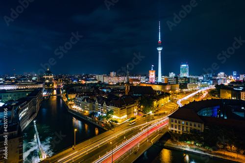 Berlin, Germany, panoramic view of Berlin cityscape and Spree River at night.