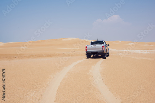 Pickup on sandy dunes in Ustyurt Nature Reserve