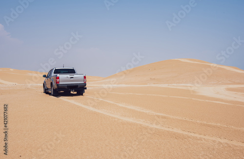 Car driving in desert during trip